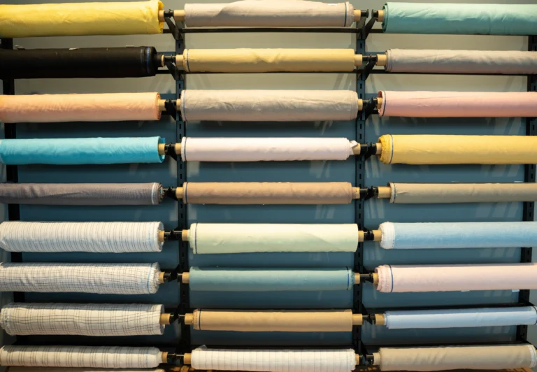 Colourful linen fabric rolls on display