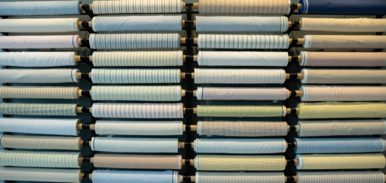 Striped linen fabric rolls on display